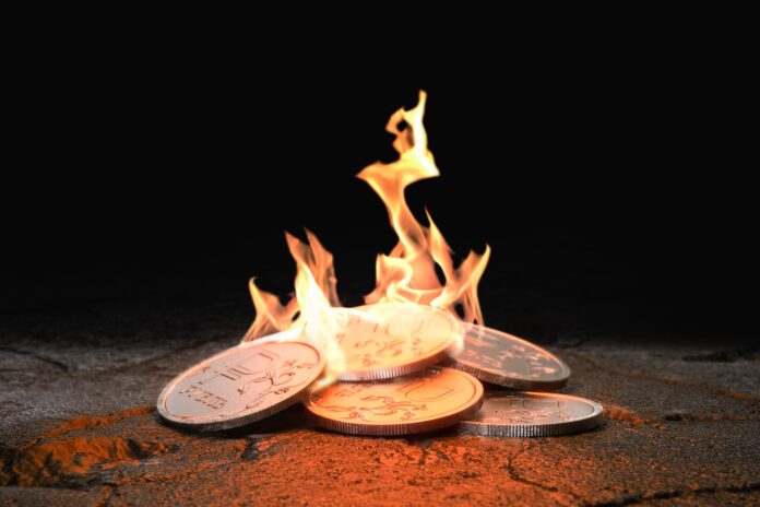 Russian Ruble coins burning on black background. Concept loss of value and inflation. 3d render